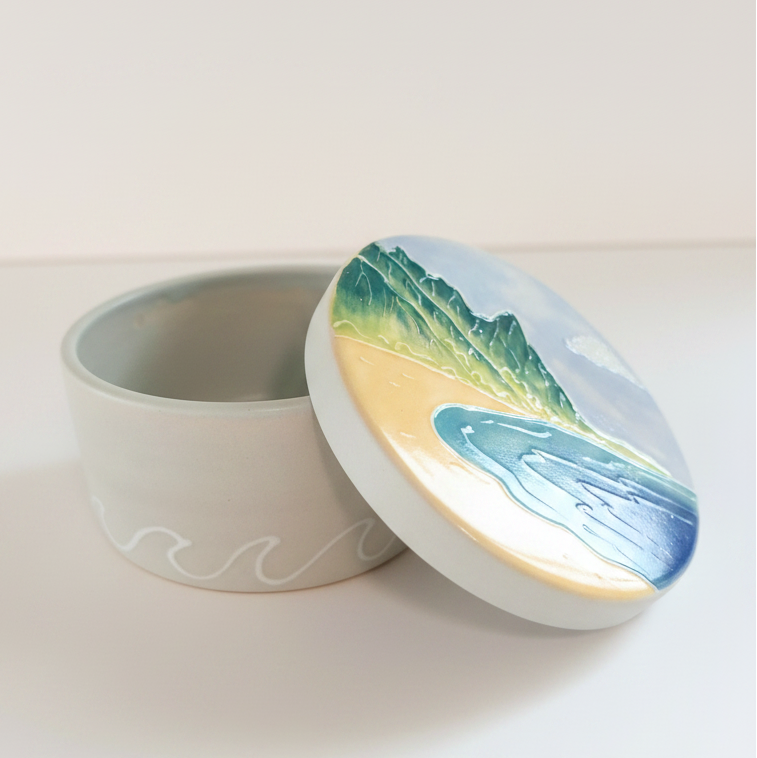 Round ceramic treasure box with Bali Hai design on a white background