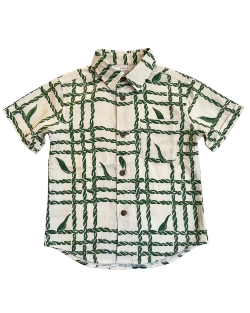 Short-sleeve shirt with green ti leaf pattern against a white background