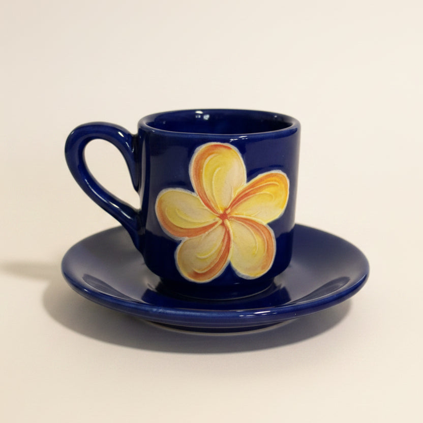 Blue mug with a floral design on a white background