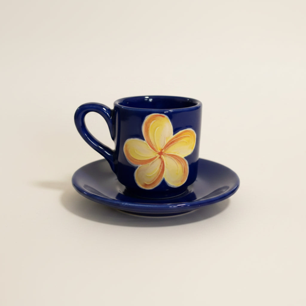 Blue mug with a floral design on a white background
