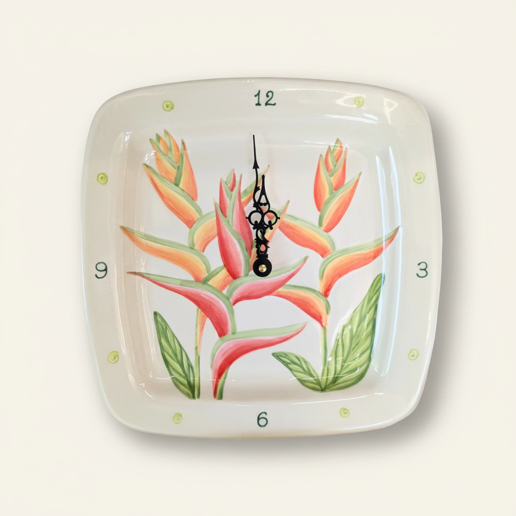A hand-painted square ceramic plate clock featuring a tropical flower design, with a black clock hands and numbers.