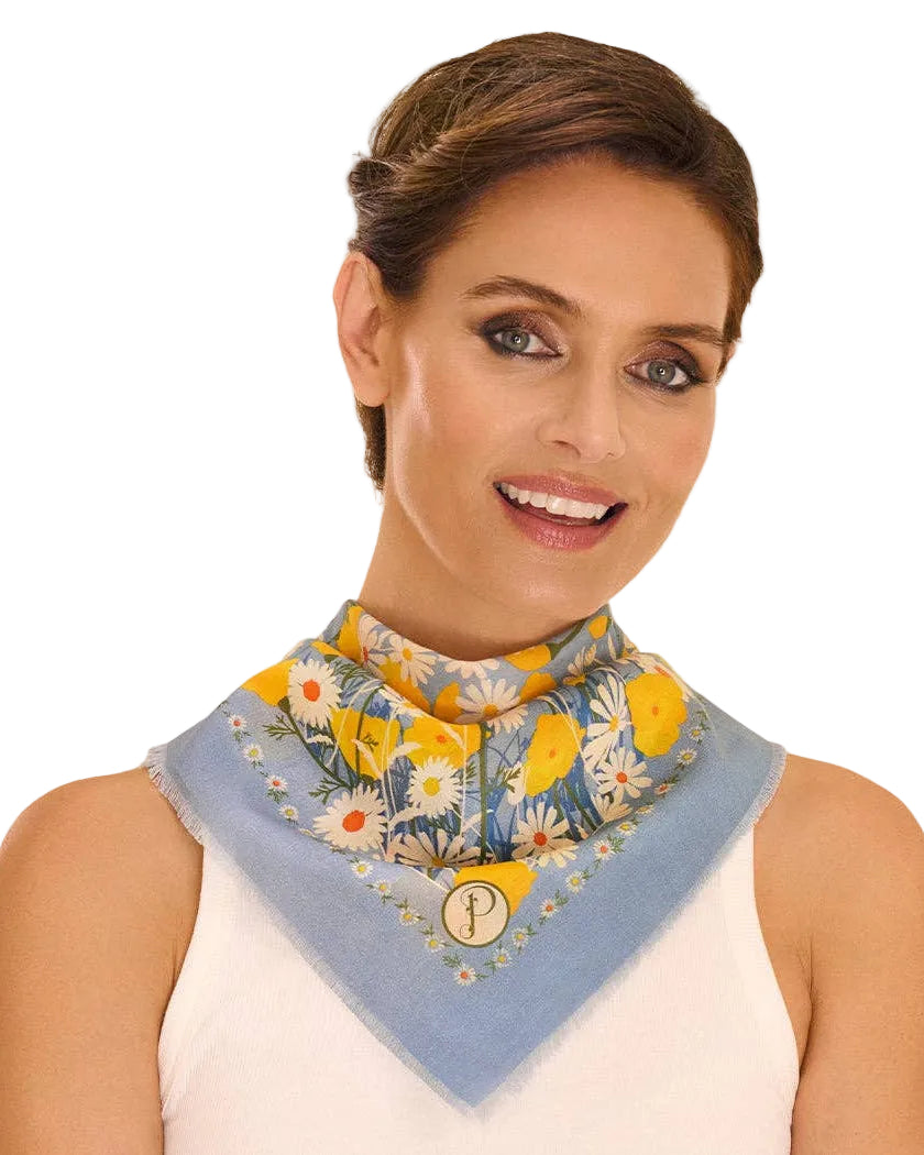 Woman wearing a floral patterned scarf on a white background