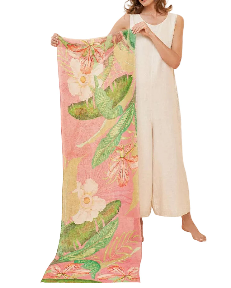 Woman holding a floral scarf with a white background