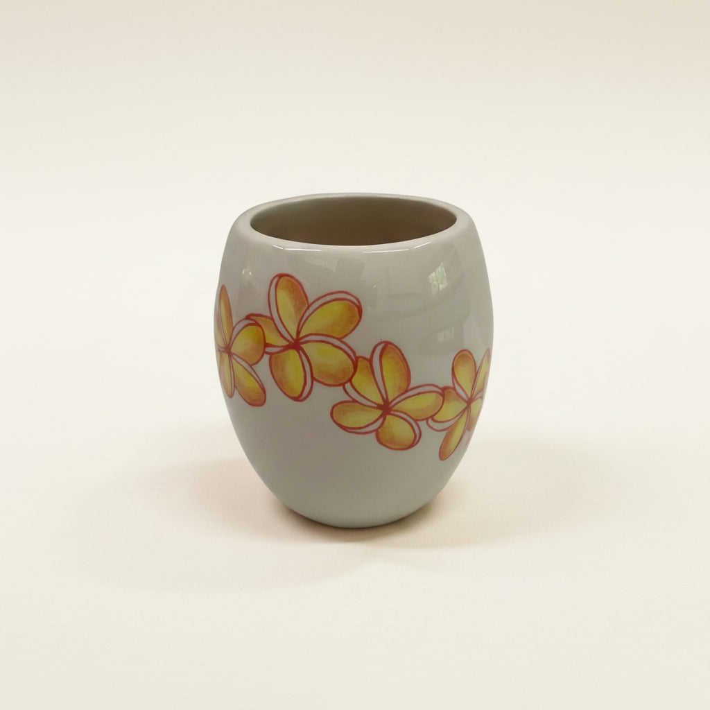 Ceramic mug with floral design on a white background