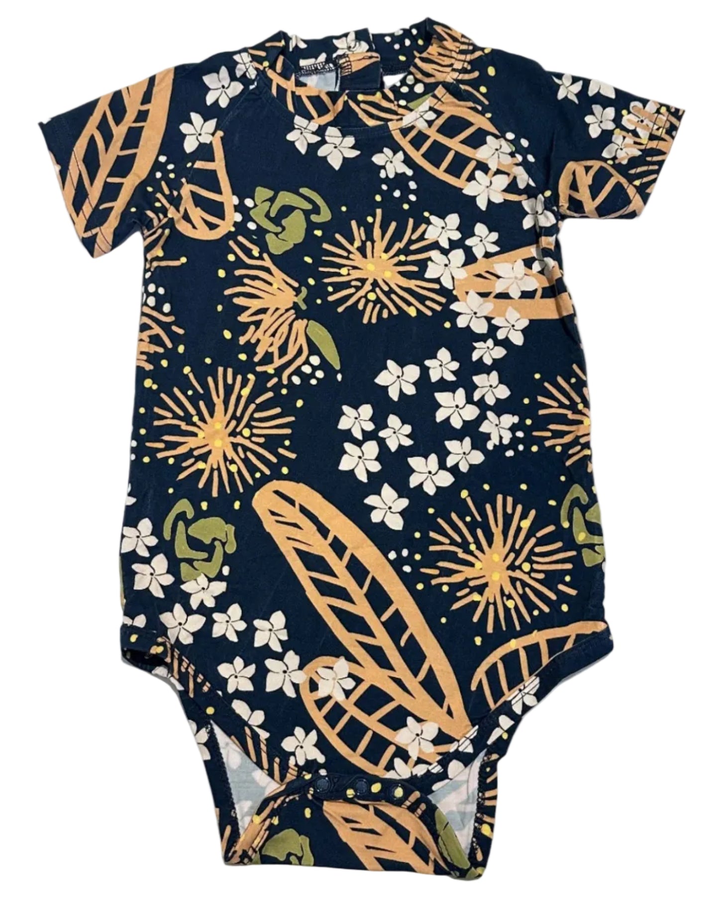 Navy baby onesie with gold and white ohia floral pattern on a white background