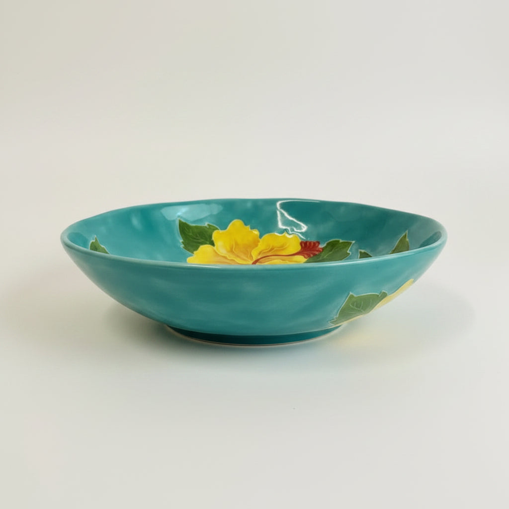 Decorative plate with yellow floral design on a blue background