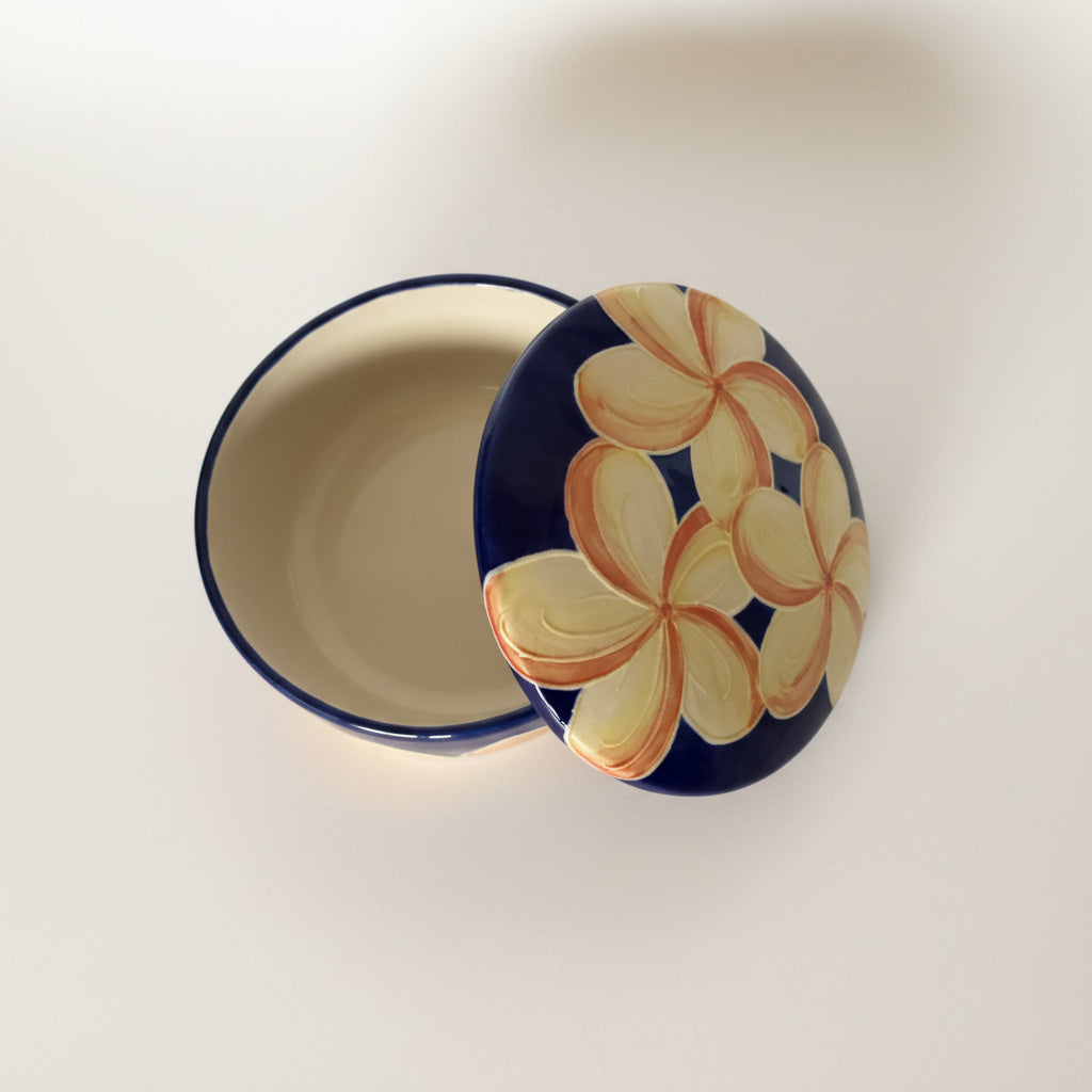 Ceramic plate with floral design on a plain background