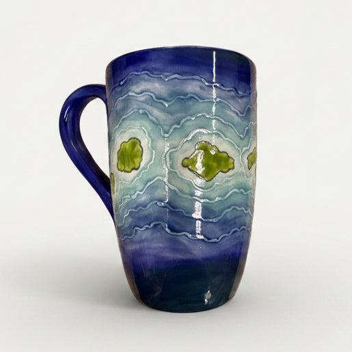 Ceramic mug with blue and green design