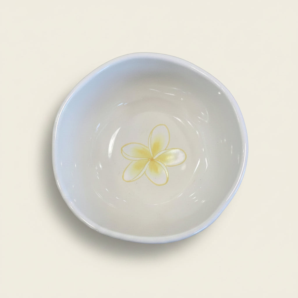 White bowl with a yellow floral design
