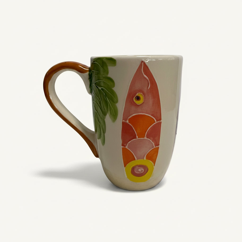 Ceramic mug with fish design on a white background