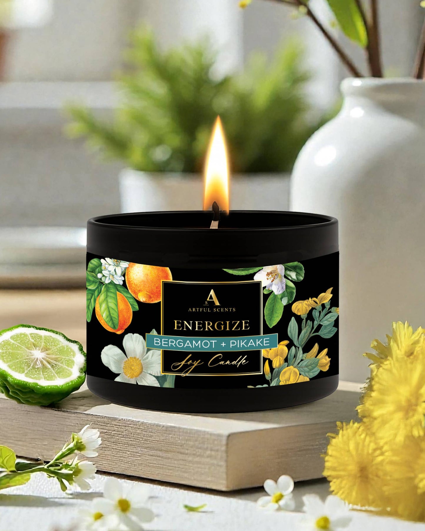 Candle with a decorative label on a surface with flowers and plants in the background