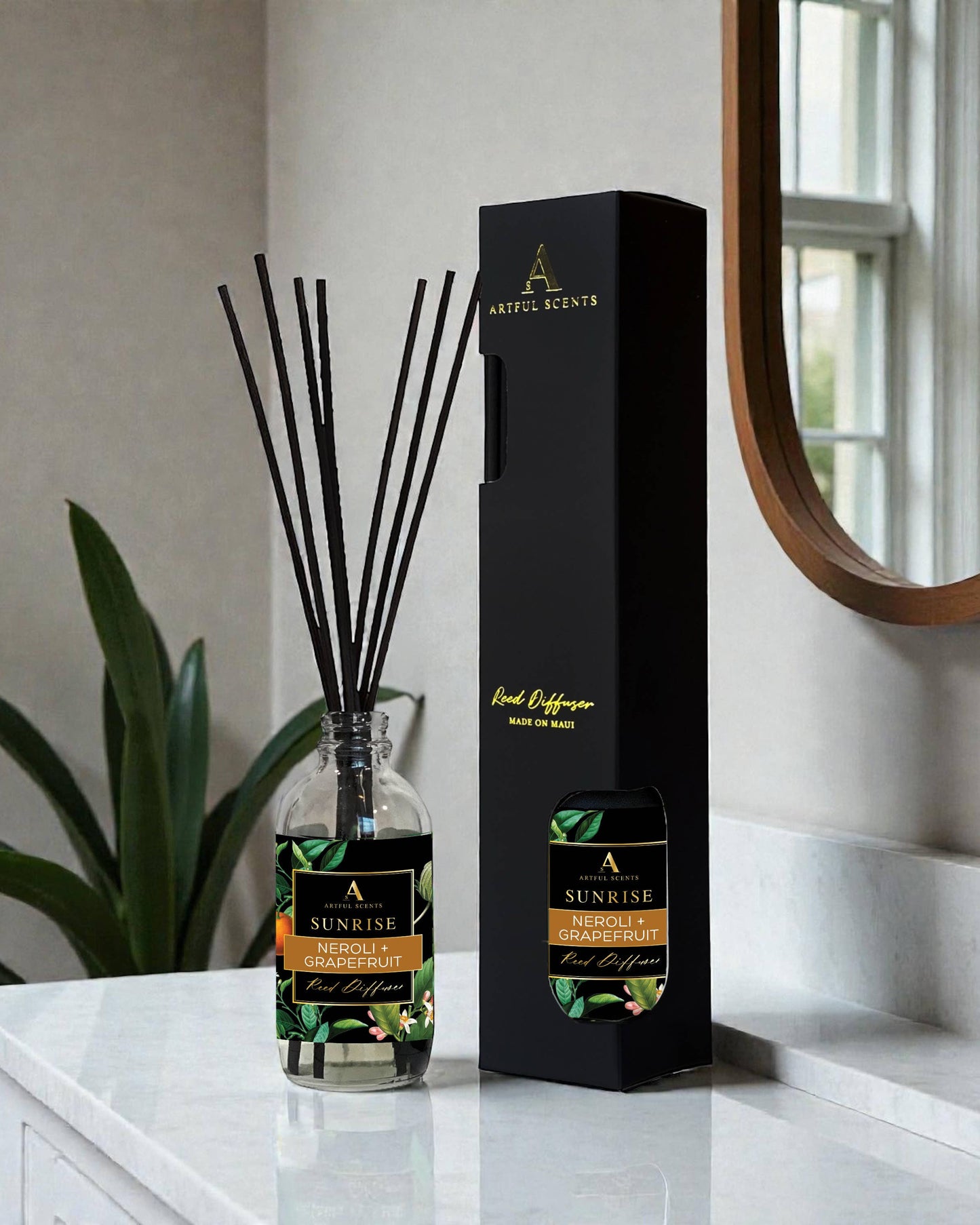 Diffuser with packaging on a marble surface with a plant and mirror in the background