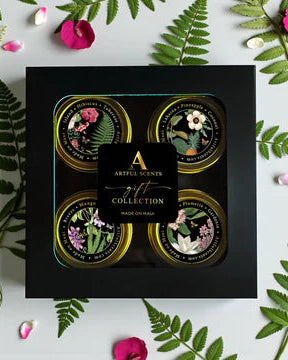 Artful Scents gift collection packaging with floral designs on a white background with green leaves and pink flowers.