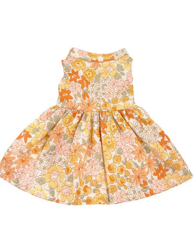 A yellow floral print doll dress with a gathered waist and short, fluttered sleeves.