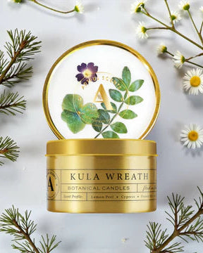 Kula Wreath botanical candles with decorative elements on a light background