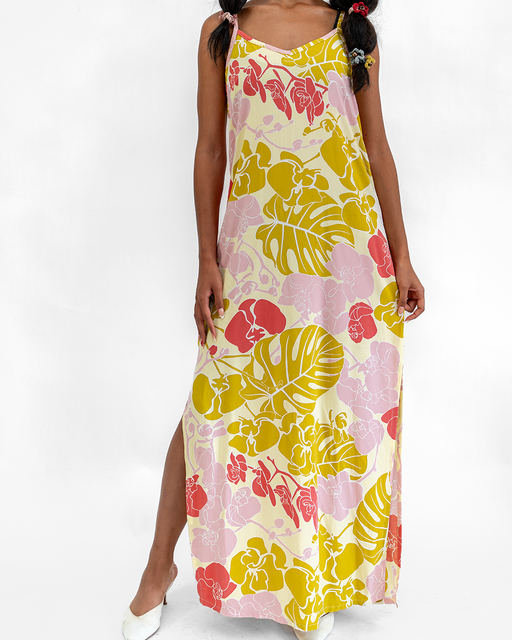 Woman wearing a floral dress with a white background