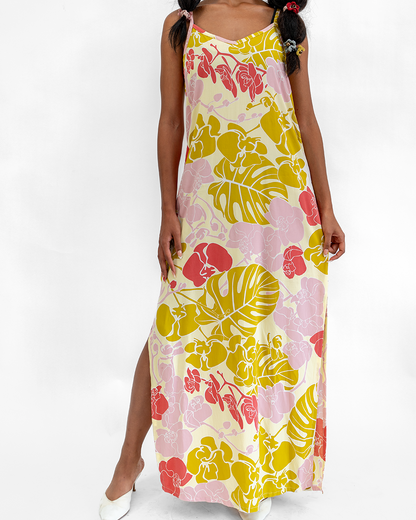 Woman wearing a floral dress with a white background
