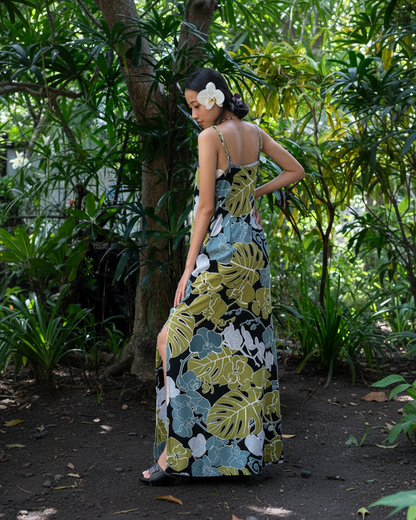 Woman wearing a floral dress in a tropical setting