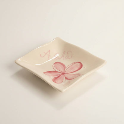 ceramic sauce dish with pink plumeria