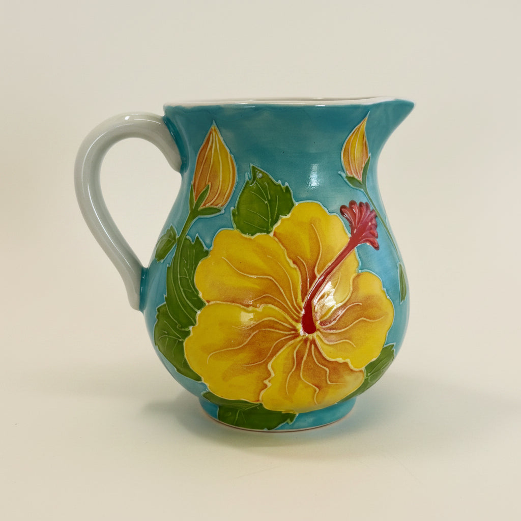 Ceramic mug with a yellow floral design on a white background