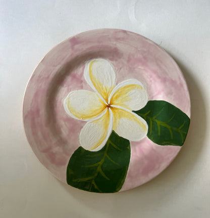 Ceramic plate with a floral design on a white background