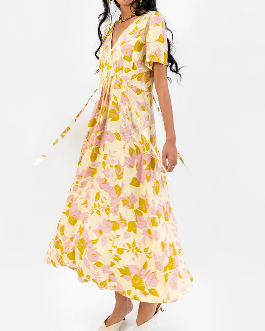 Woman wearing a floral dress on a white background