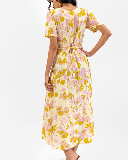 Woman wearing a floral dress with a white background